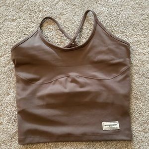 The giving movement top, never worn.
